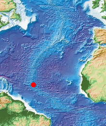 Imagen de la cresta mesoatlántica. El punto rojo indica el area donde los científicos trabajarán. Imagen barimetrica cortesia de GEBCO